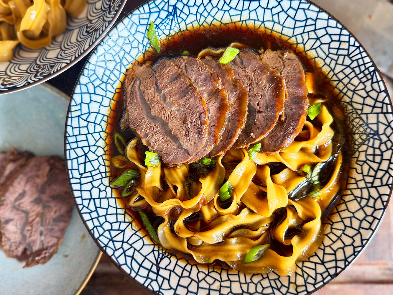 Soup with knife-cut noodles and slices of beef shank
