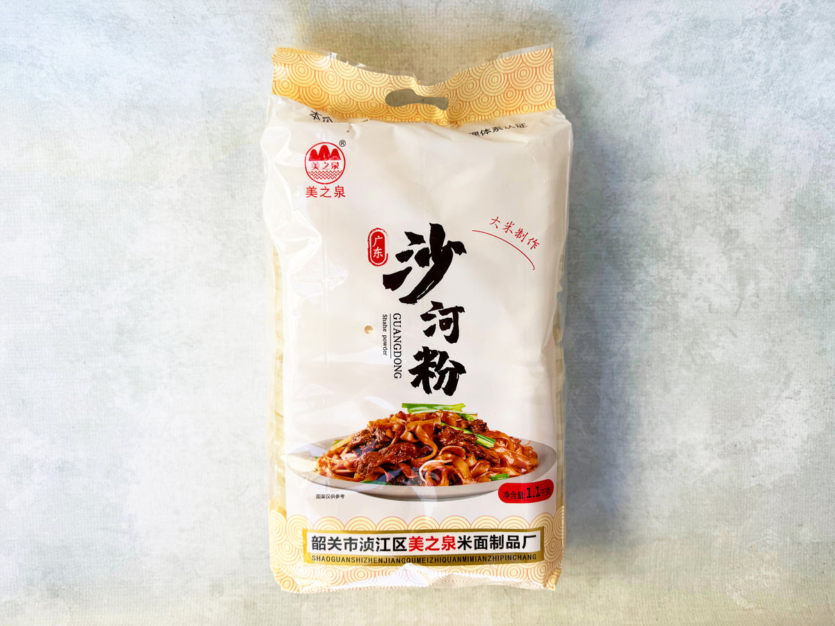 a large plastic bag of dried wide rice noodles from Guangdong with a picture of chow fun on the packaging