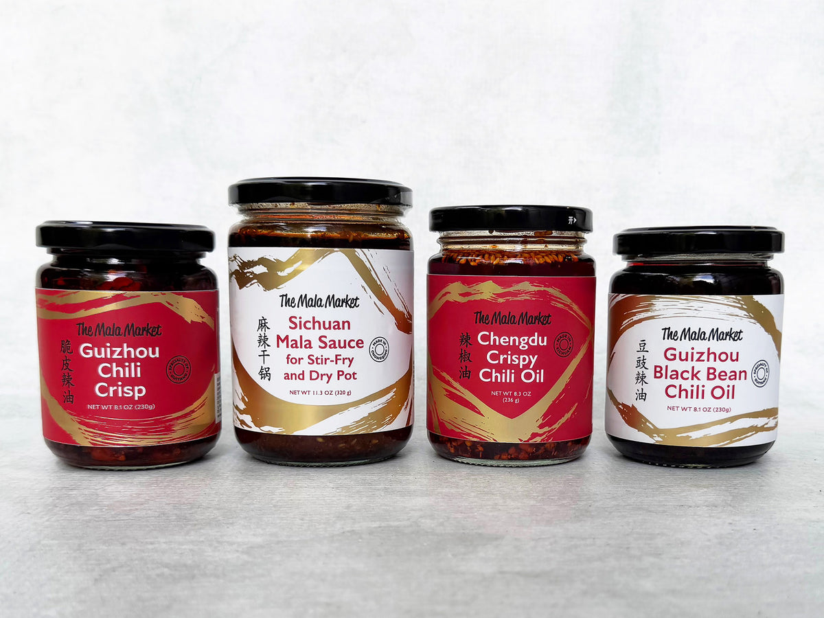 four jars of chili oils and sauces from The Mala Market made in Sichuan and Guizhou