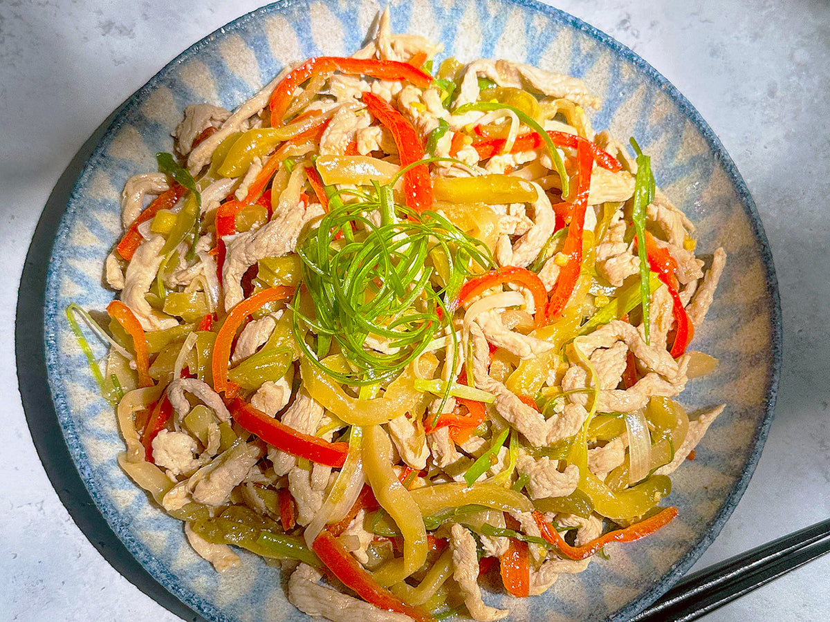 pork and zhacai stir-fry on a blue plate