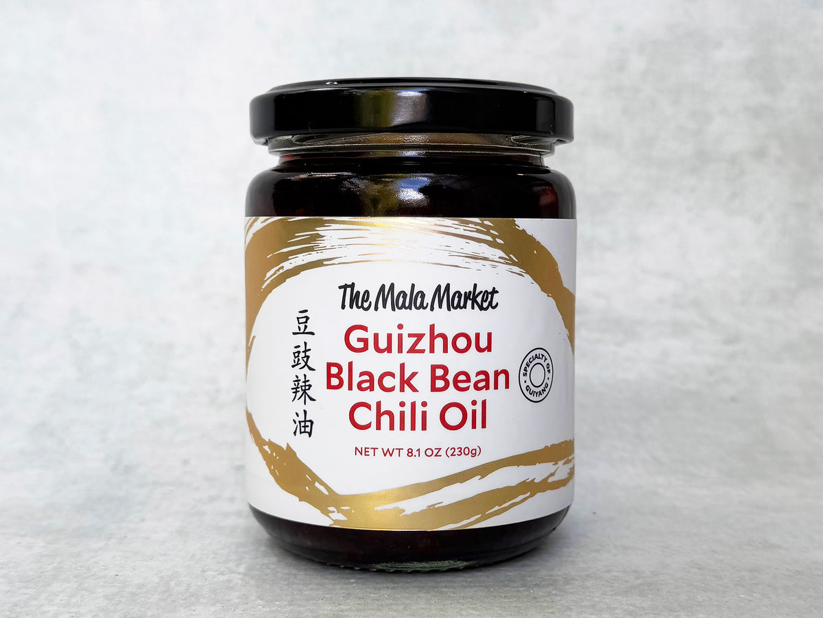a glass jar of Mala Market chili oil with fermented black beans 