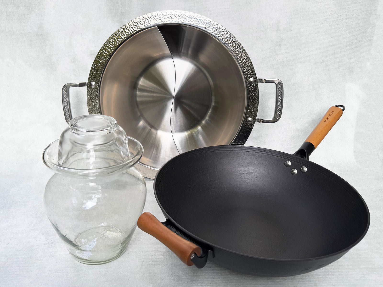 Cast iron wok, stainless steel hotpot and glass pickle jar