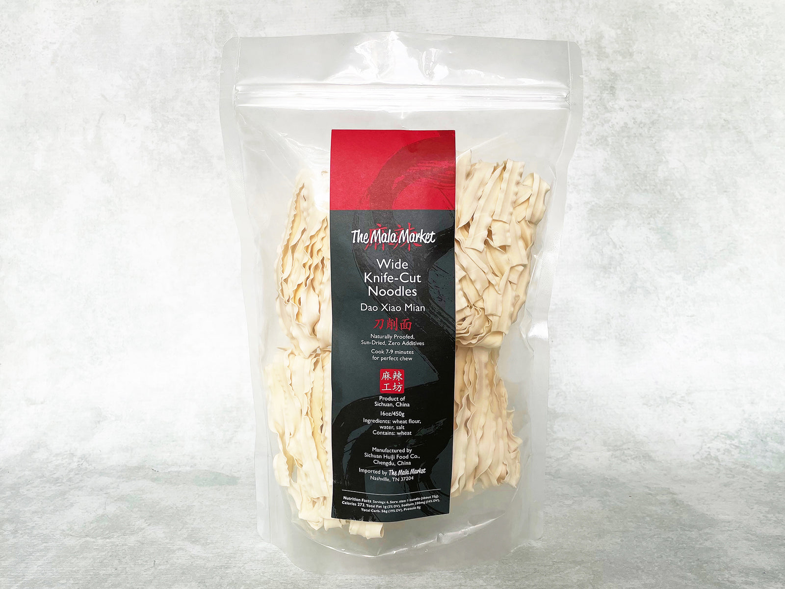 Packaged bundles of knife-cut noodles (Sun-Dried Dao Xiao Mian) in a clear plastic, resealable bag 