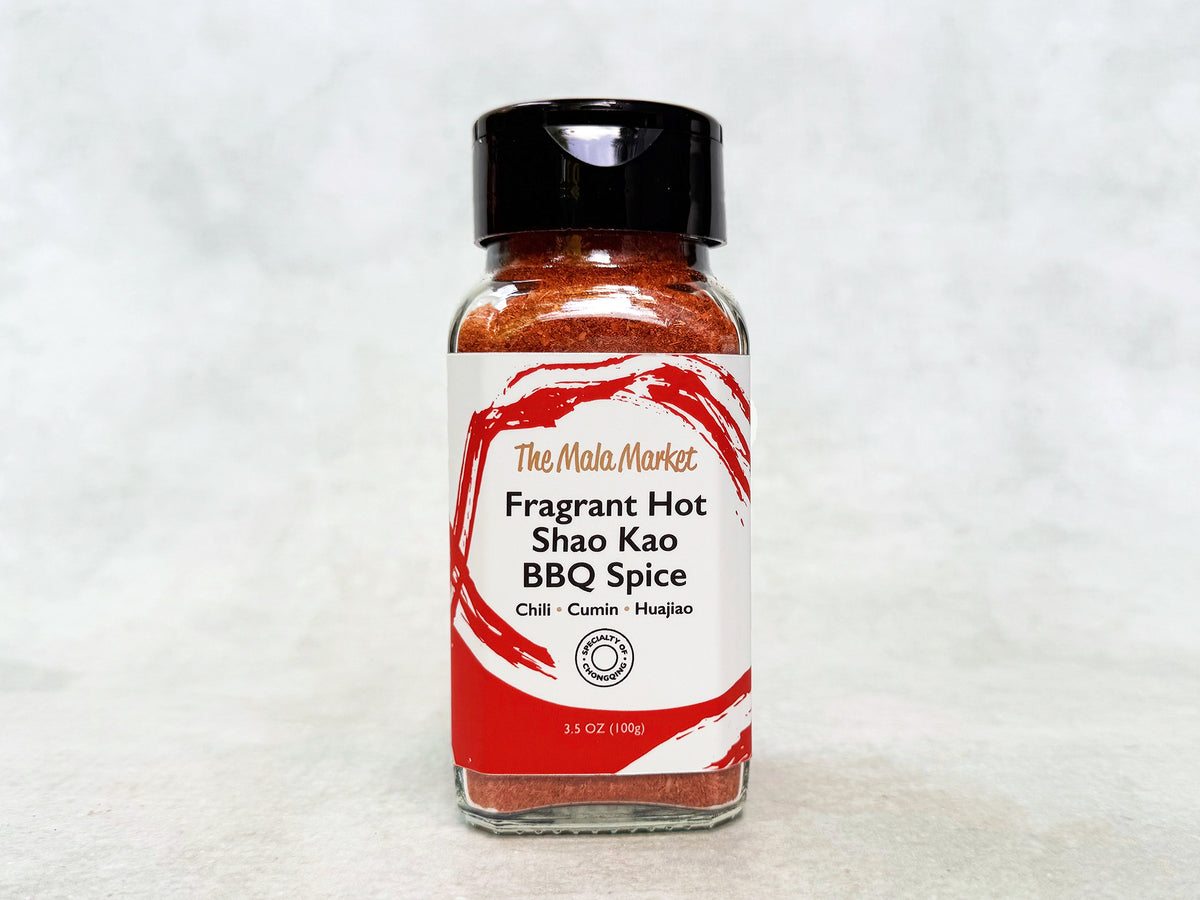 a glass jar of red Chinese BBQ spice in fragrant hot flavor