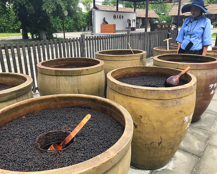 open-topped crocks holding soy sauce at Zhongba factory 