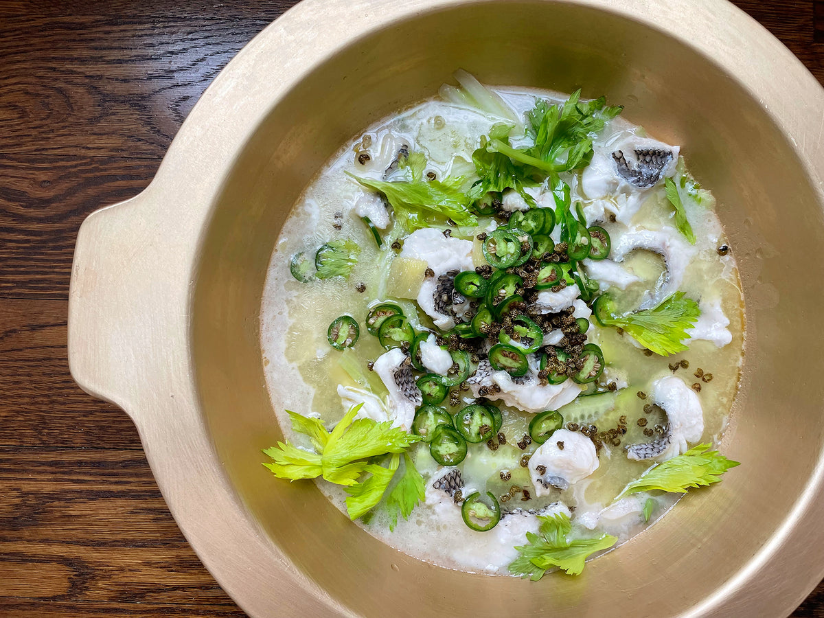 Green Sichuan pepper fish stew in a gold pot