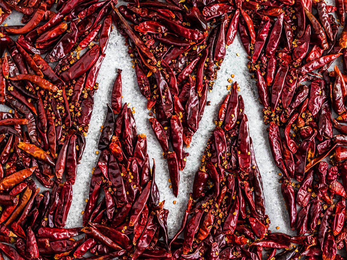 Mala Market Gift Card showing the letter M made out of dried chilies and Sichuan peppercorns