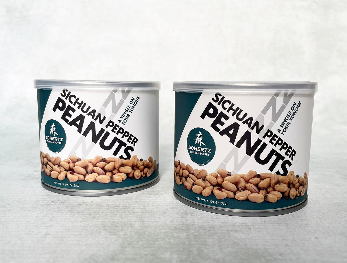 a set of 2 metal cans of Sichuan pepper peanuts with plastic lids