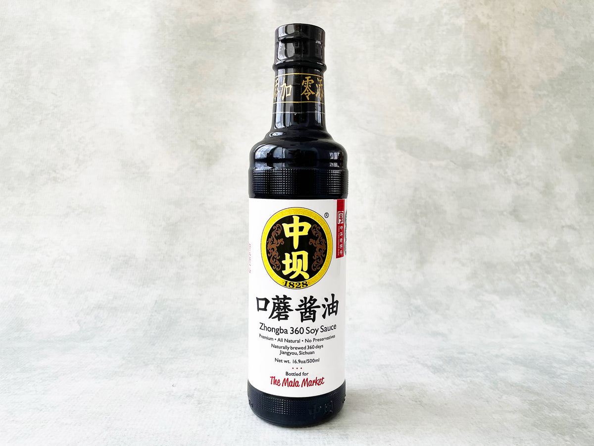 a glass bottle of Zhongba soy sauce with a white label made for The Mala Market
