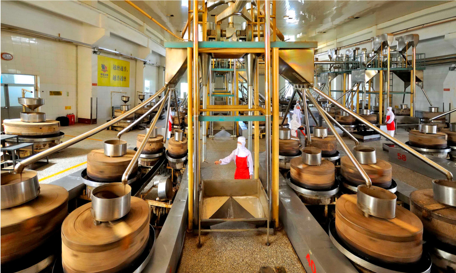 sesame oil factory showing small stone mills