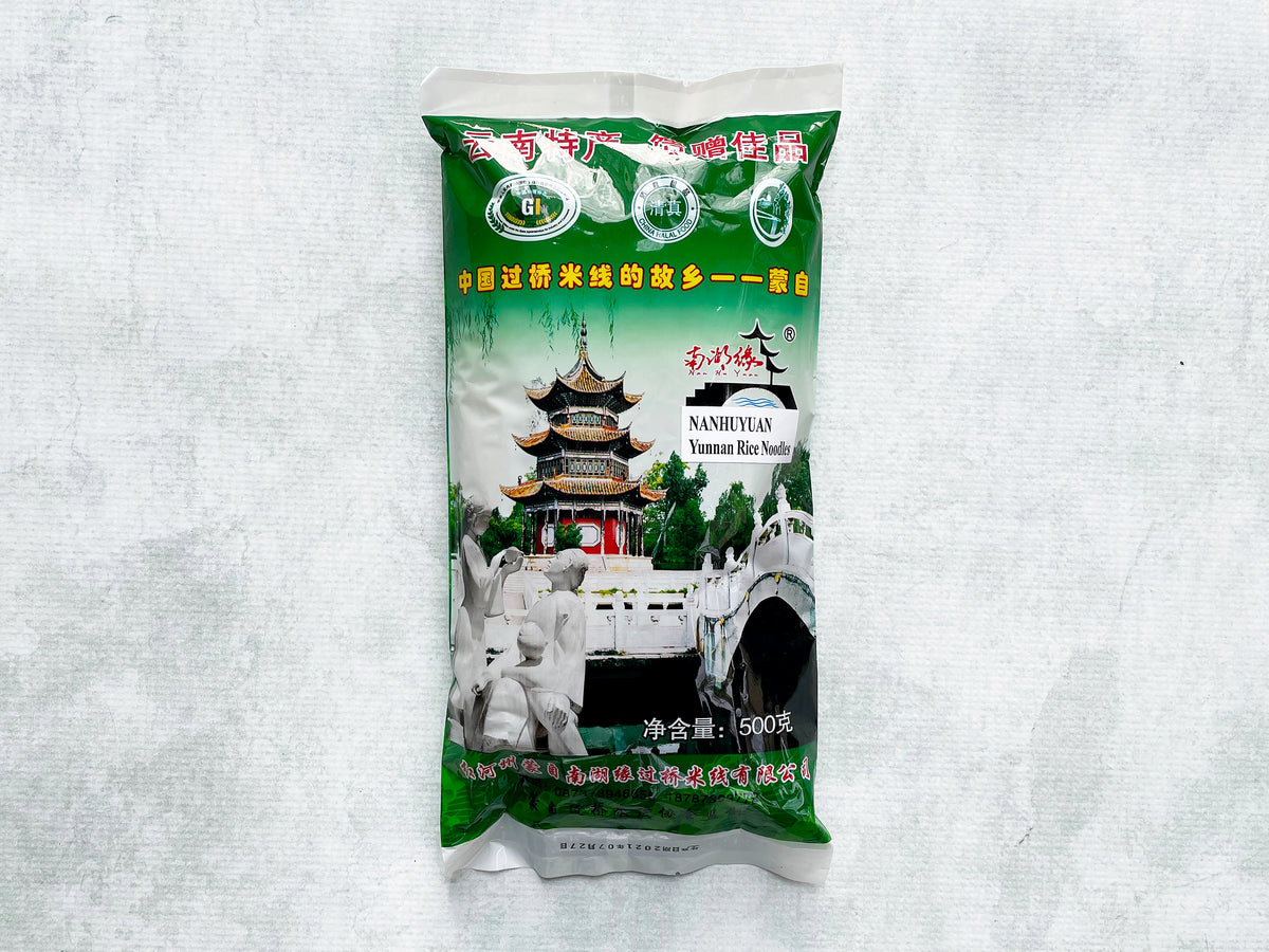 a green plastic bag of dried Yunnan rice noodles 